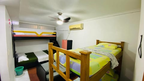 Bed, Photo of the whole room, Bedroom, bunk bed, towels, air conditioner