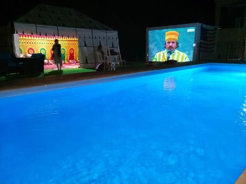 Communal lounge/ TV room, Evening entertainment, Pool view, Swimming pool