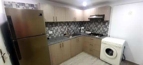 Kitchen or kitchenette, stove, washing machine