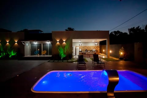 Property building, Patio, Night, Pool view, Swimming pool, sunbed