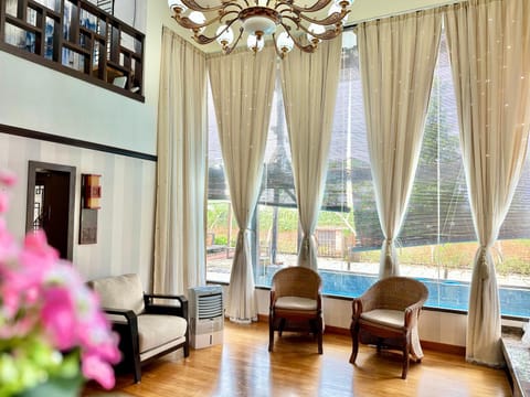 Living room, Seating area, Garden view, Pool view