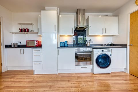 Kitchen or kitchenette, dishwasher, washing machine, dryer