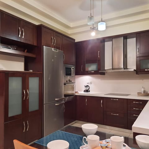 Kitchen or kitchenette, dishwasher, microwave, oven, stove