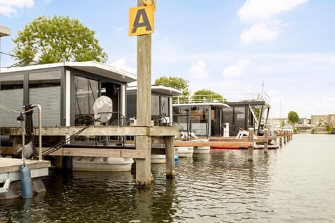 Cosy tiny houseboats near beach and restaurants Docked boat in Zeewolde