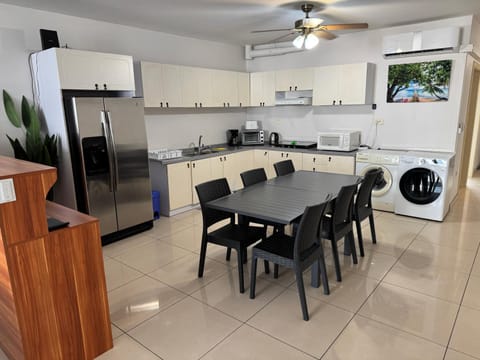 Kitchen or kitchenette, Dining area, oven, stove, toaster, washing machine, dryer, air conditioner