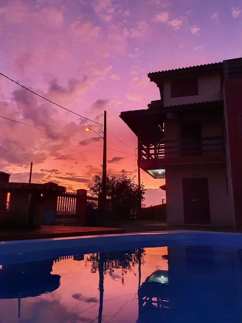 Property building, Swimming pool, Sunset