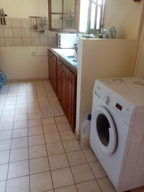 Kitchen or kitchenette, washing machine