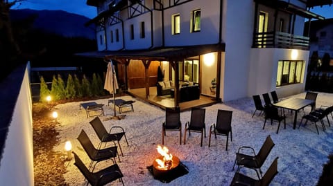 Property building, Patio, Night, BBQ facilities, Seating area, Dining area, flat iron