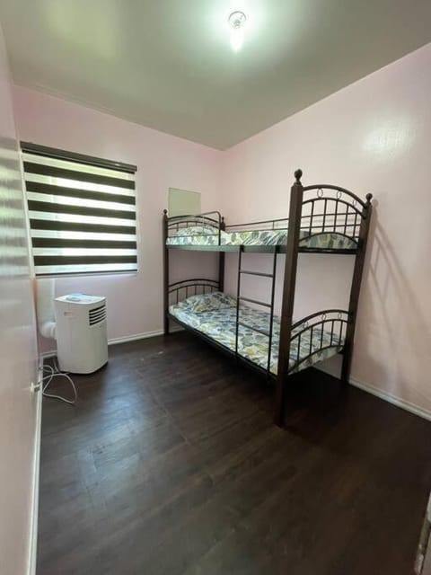 Big Family Room with PS4, WI-FI, Netflix & Pool Condo in Muntinlupa