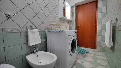 Bathroom, bidet, washing machine