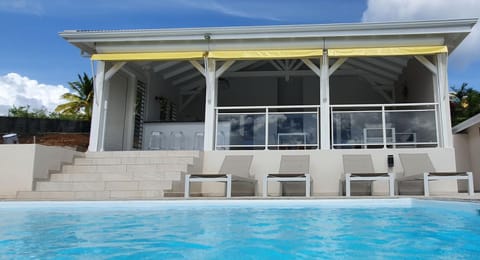 Property building, Patio, Swimming pool, sunbed