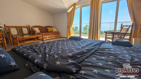 Bed, Natural landscape, Seating area, Bedroom, Sea view