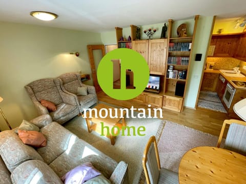 Property logo or sign, TV and multimedia, Living room, Seating area, Dining area, Logo/Certificate/Sign