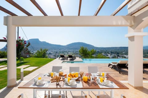 Patio, Natural landscape, Dining area, Mountain view, Pool view, Swimming pool, sunbed