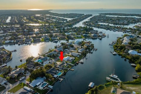 Waterside Retreat is a Spectacular Waterfront Apollo Beach Home with screened in Heated Pool House in Apollo Beach