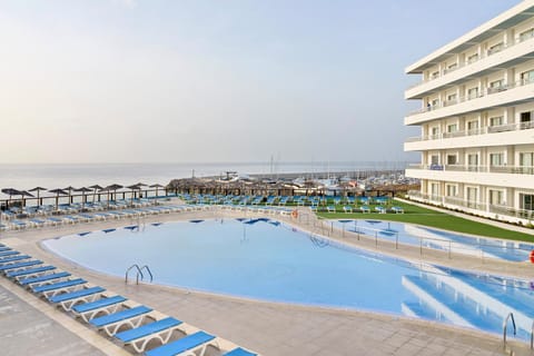 Balcony/Terrace, Seating area, Sea view, Swimming pool, sunbed