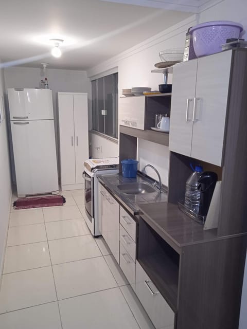 Kitchen or kitchenette, microwave, oven, stove, washing machine