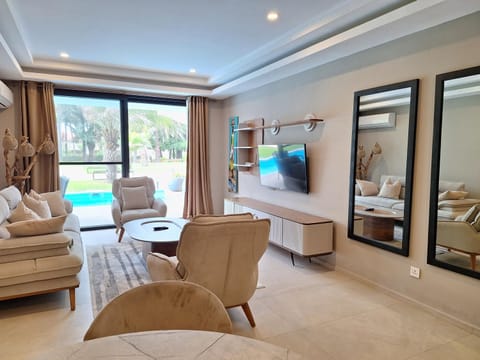 TV and multimedia, Living room, Seating area, Pool view, Swimming pool