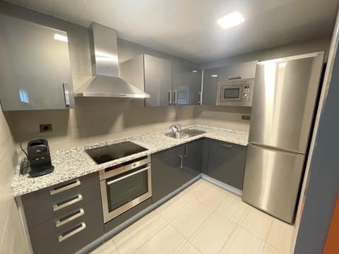 Kitchen or kitchenette, oven, stove