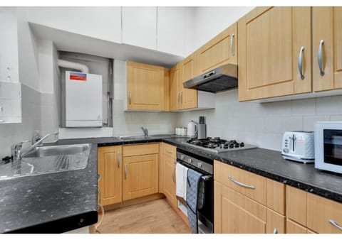 Kitchen or kitchenette, microwave, oven, stove, toaster