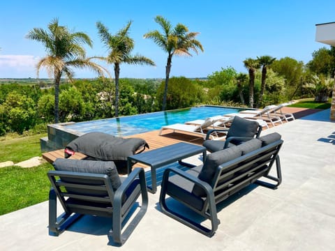 Patio, Day, Natural landscape, Garden, Living room, Garden view, Pool view, Swimming pool, sunbed