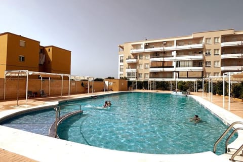 Property building, People, Swimming pool, Swimming pool, sunbed