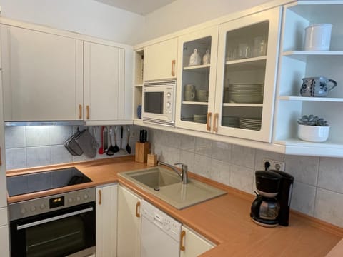 Kitchen or kitchenette, stove, kitchen