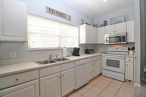 Kitchen or kitchenette, dishwasher, oven, stove