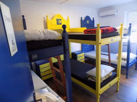 Photo of the whole room, bunk bed, air conditioner