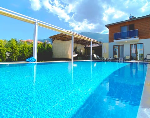 Property building, Patio, Swimming pool, sunbed