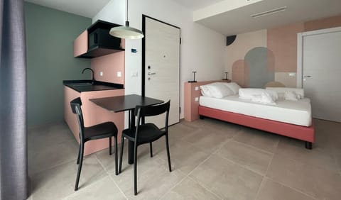 Bed, hair dresser, towels, wardrobe