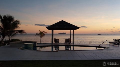 Seacada- Beachfront - Pool - Panoramic Sunsets Condo in George Town