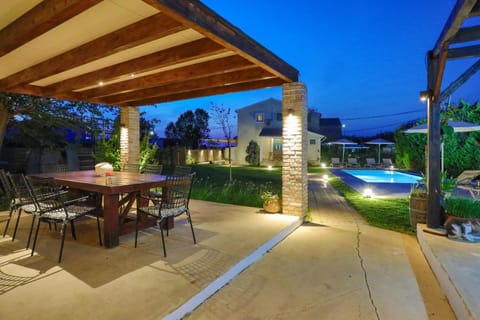 Patio, Night, Dining area, Swimming pool