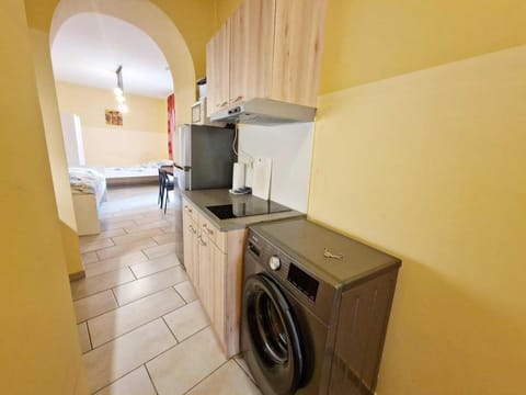 Kitchen or kitchenette, washing machine