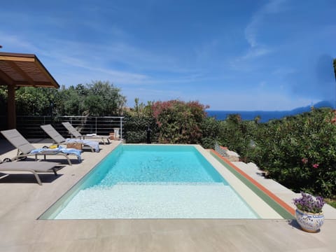 Property building, Patio, Day, Natural landscape, Pool view, Sea view, Swimming pool, sunbed