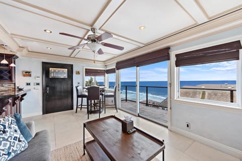 Patio, View (from property/room), Balcony/Terrace, Living room, Seating area, Dining area, Beach, Sea view, fireplace