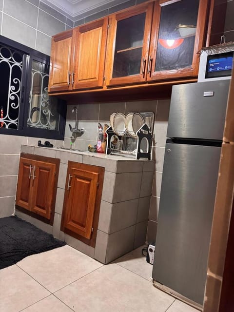 Kitchen or kitchenette, dishwasher, oven, stove