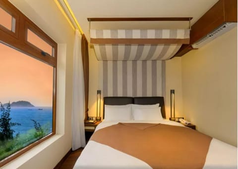 Bed, Natural landscape, Bedroom, Sea view