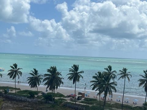 On the beach, white sand, sun loungers, beach umbrellas