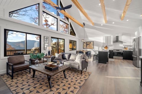 The wall of windows allows natural light to flow through the space