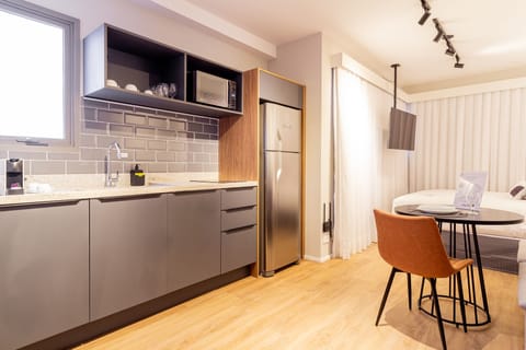 Studio Couple with Balcony | Private kitchen | Full-size fridge, microwave, stovetop, espresso maker