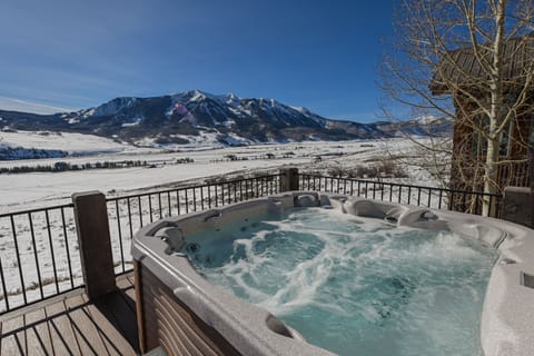 Soak up serenity, in an 8 person hot tub with a view that speaks volumes!