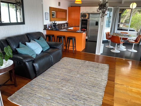 Downstairs lounge and kitchen leading out to the large deck.