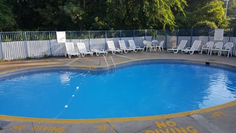 Seasonal outdoor pool, open 9:00 AM to 8:00 PM, sun loungers