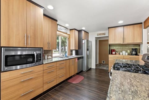 Side door off kitchen leads to pantry/laundry room, and the door to the garage.