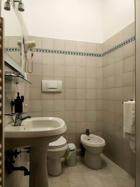 Standard Quadruple Room | Bathroom | Shower, rainfall showerhead, hair dryer, bathrobes