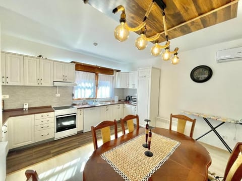 Deluxe Villa | Private kitchen | Fridge, stovetop, dishwasher, electric kettle