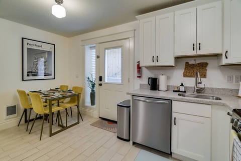 The kitchen is fully equipped with stainless steel appliances including a gas stove, microwave, dishwasher, refrigerator, Ninja blender, and toaster.