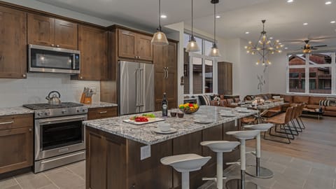Main level kitchen with breakfast bar seating