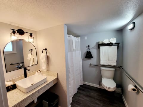 Marina Room King Fireplace | Bathroom | Shower, hair dryer, towels, soap